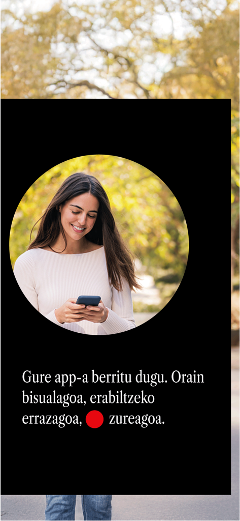 Kutxabank - A woman smiling while using her smartphone with a Basque message about the new Kutxabank app design