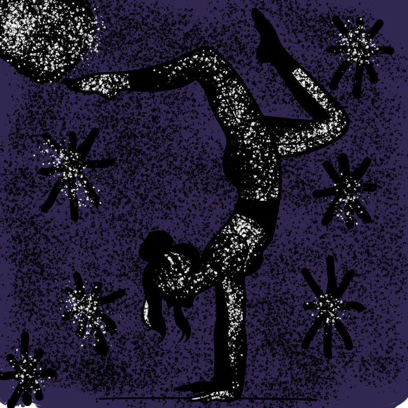 a woman doing a handstand