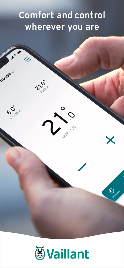Vaillant vSMART Control - Hand holding a smartphone showing the Vaillant vSMART Control app interface for remote temperature management.