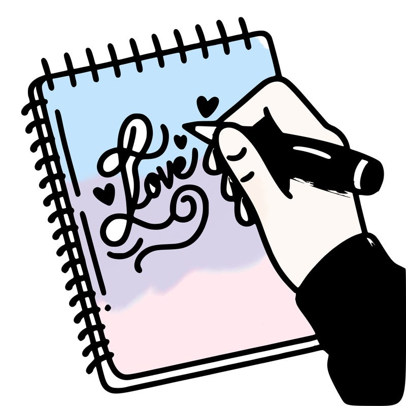 a hand writing “love” in calligraphy on a notebook