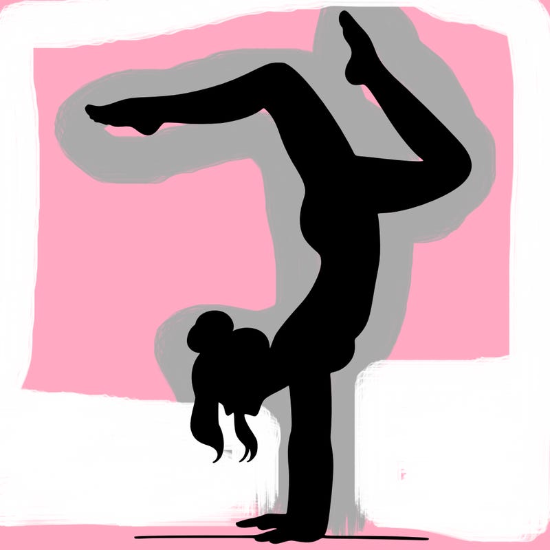 a woman doing a handstand