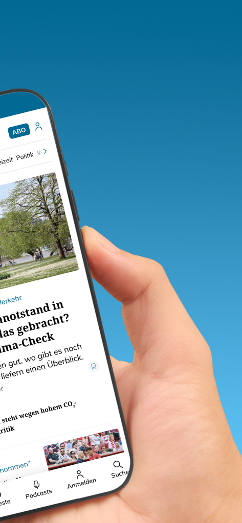 Una mano sosteniendo un smartphone mostrando la interfaz de la aplicación de noticias KSTA Nachrichten con artículos de noticias locales