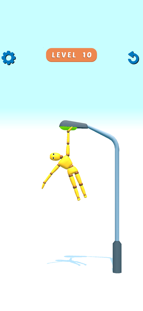 Ragdoll Games: Breaking Bones - Un muñeco ragdoll amarillo colgando de una farola en el nivel diez de un juego basado en física.