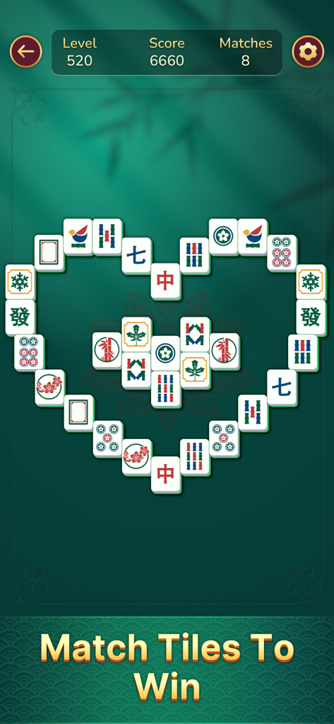 Jolly Mahjong - Jolly Mahjong game screen featuring a heart shaped puzzle with large easy to read tiles
