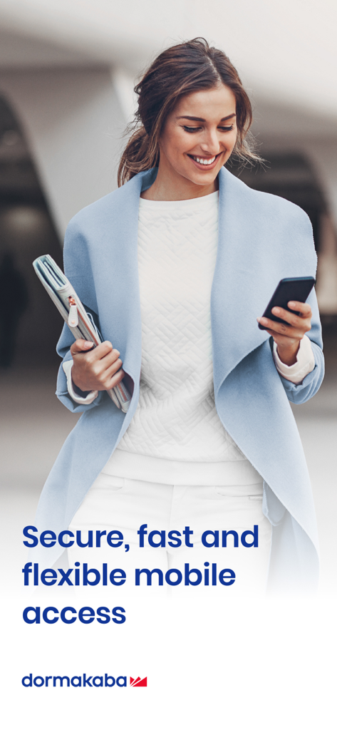 Professional woman using the dormakaba mobile access app on her smartphone