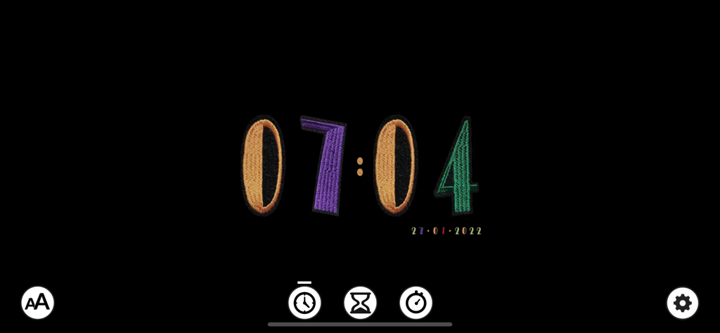 TimeFont app displaying a digital clock with a colorful embroidered font on a dark background
