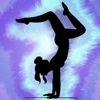 a woman doing a handstand
