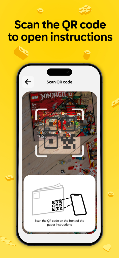 Smartphone scanning a QR code on a LEGO manual to open digital building instructions