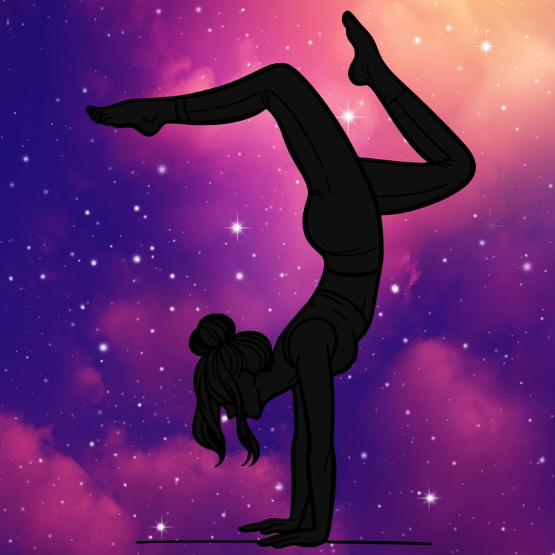 a woman doing a handstand