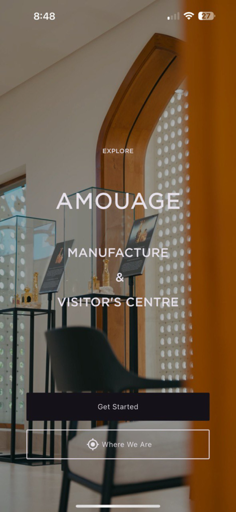 Amouage Visitors' Center - Home screen of the Amouage Visitors Center app showing the Manufacture and Visitor Centre welcome page