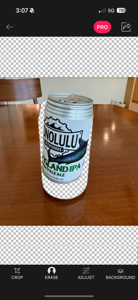 A mobile app interface showing a beer can being isolated from its background using an eraser tool