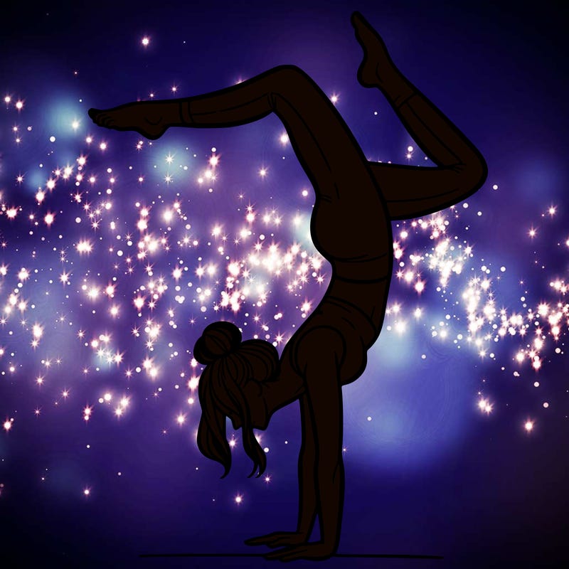 a woman doing a handstand