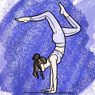 a woman doing a handstand