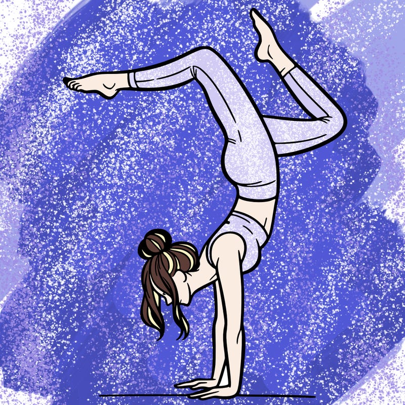 a woman doing a handstand