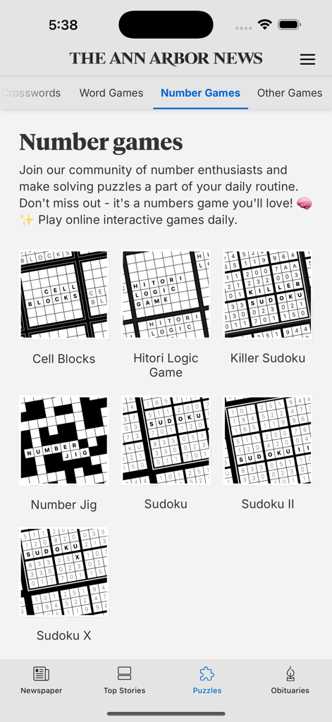 The Ann Arbor News app screen showing interactive number puzzles and Sudoku games