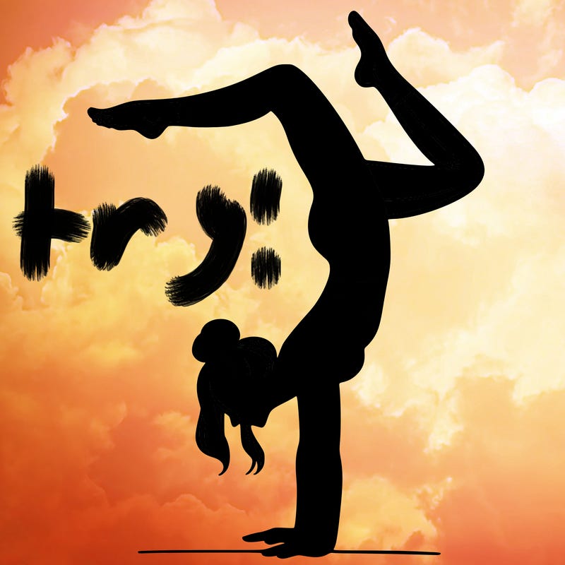 a woman doing a handstand