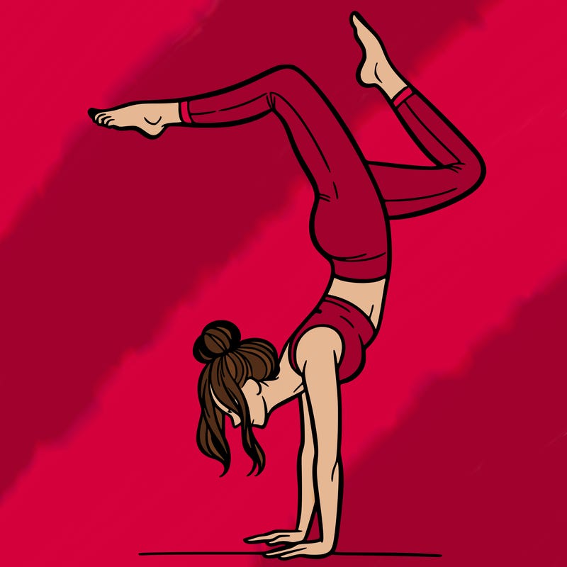 a woman doing a handstand