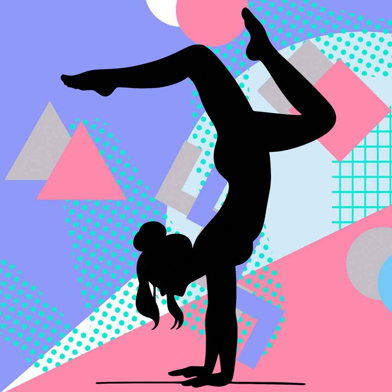 a woman doing a handstand