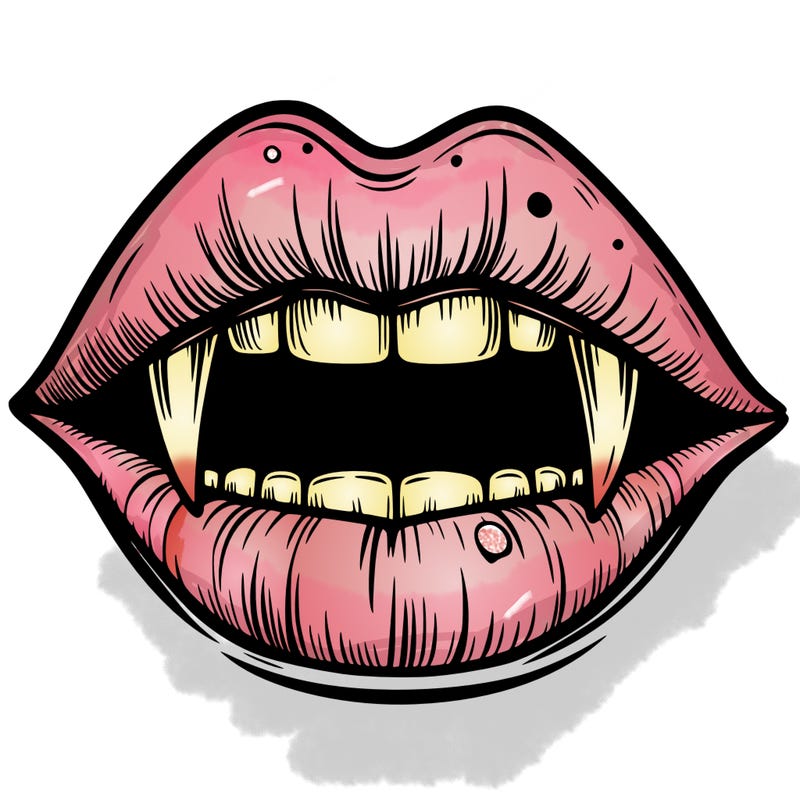 lips with vampire teeth