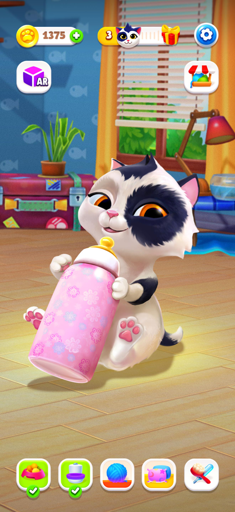 A cute virtual kitten sitting and holding a pink baby bottle with floral patterns
