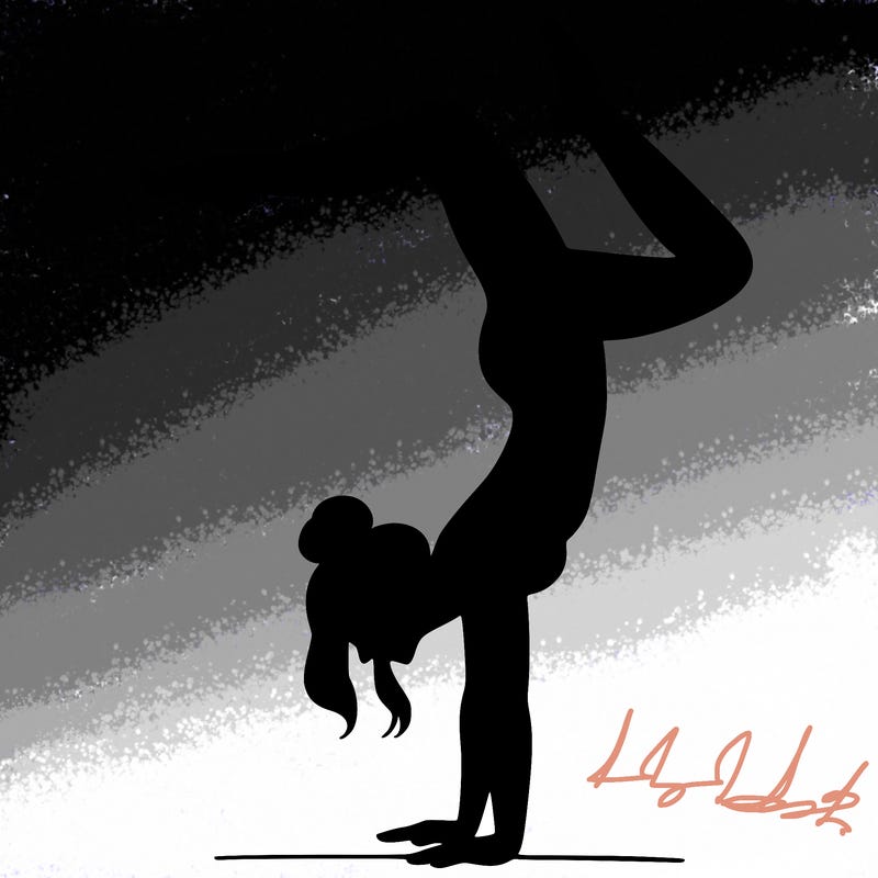 a woman doing a handstand