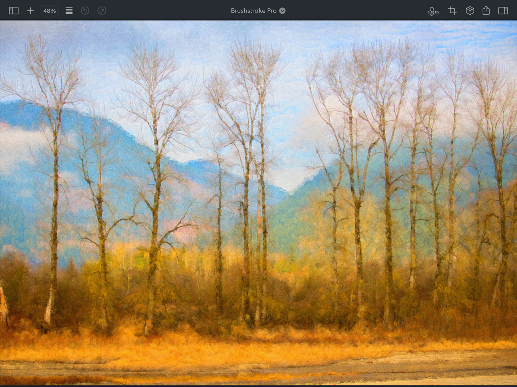 Brushstroke Pro for iPad - A digital oil painting of tall winter trees and blue mountains created in the Brushstroke Pro app on iPad