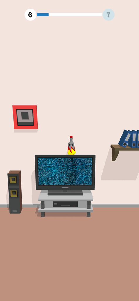 Gameplay screen of Bottle Flip 3D showing a bottle landing on top of a television