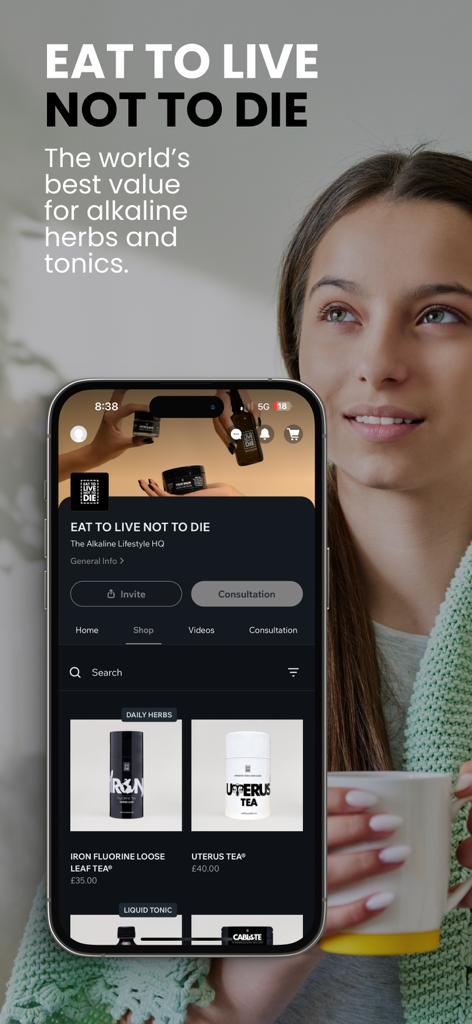 EAT TO LIVE NOT TO DIE - A woman holding a phone showing the EAT TO LIVE NOT TO DIE app store with alkaline herbs and tea products.