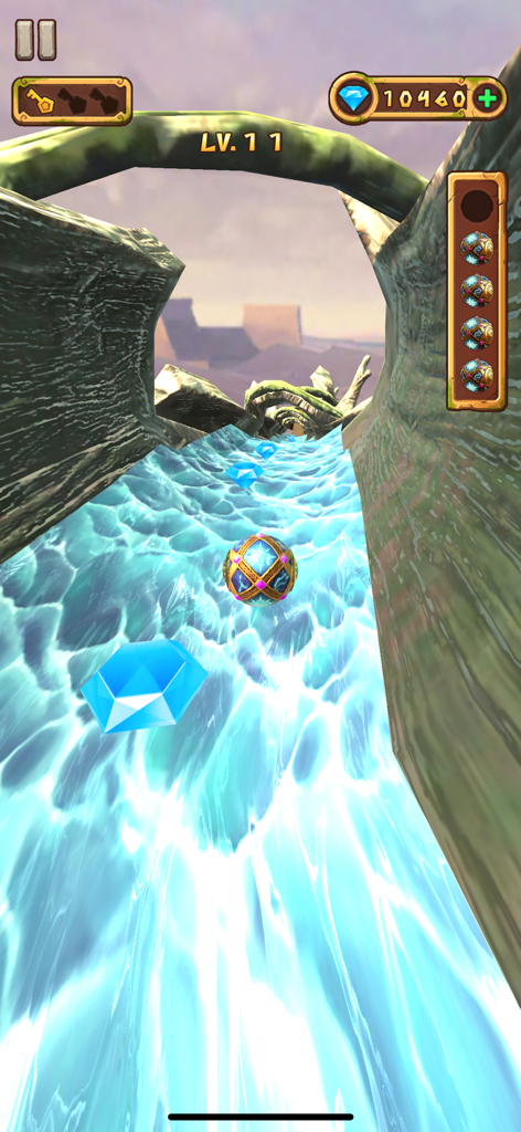 Temple Rolling Balls - An ornate ball rolls down a water slide in a temple level collecting blue diamonds