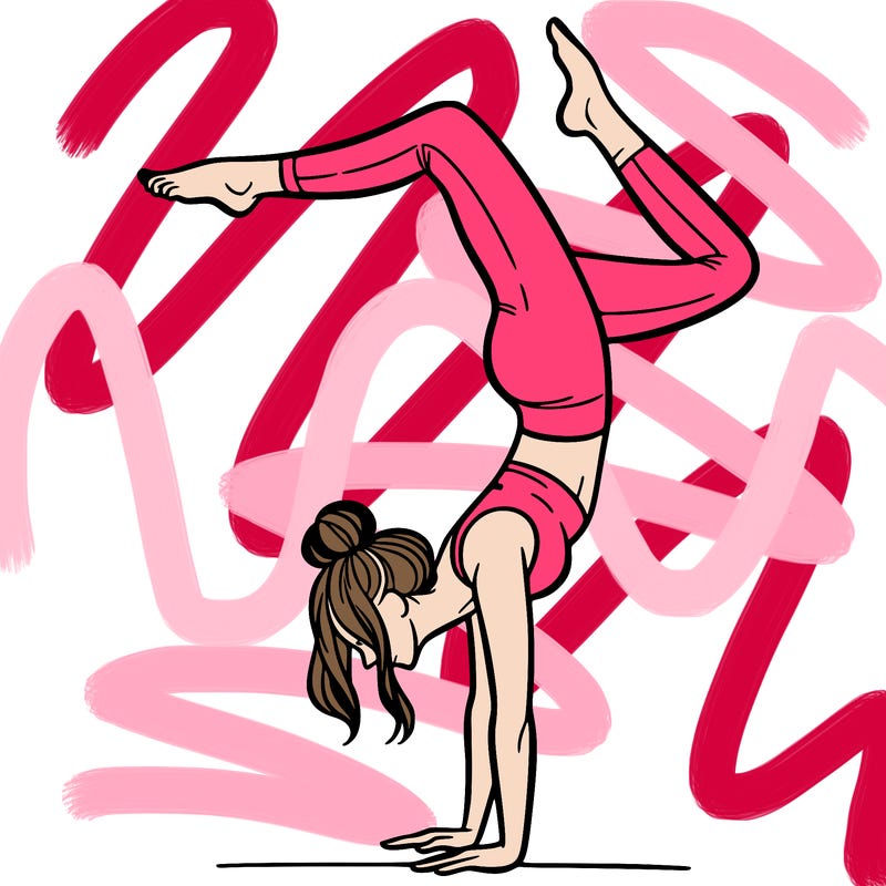 a woman doing a handstand