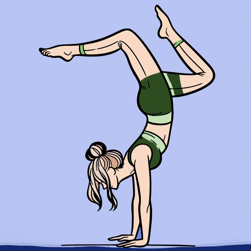 a woman doing a handstand