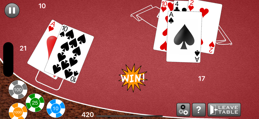 Une main de blackjack gagnante montrant vingt et un points sur une table de casino rouge avec des jetons