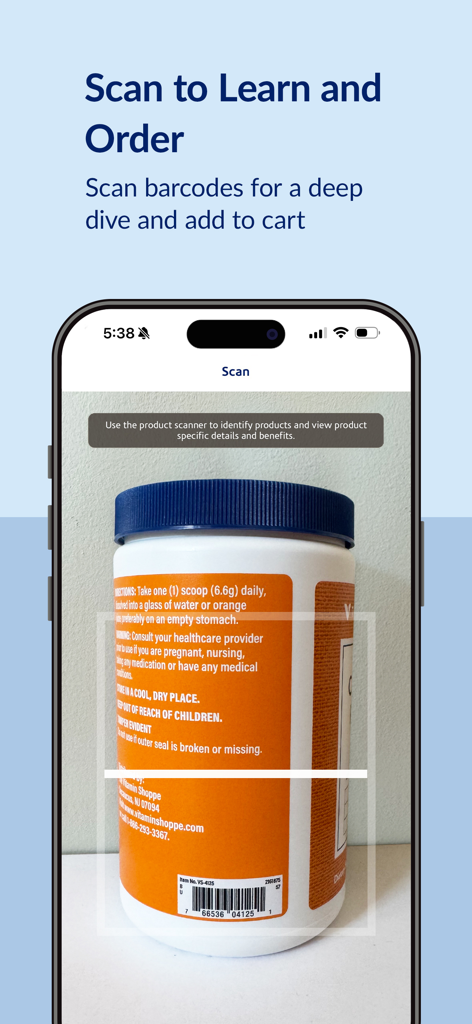 A smartphone using The Vitamin Shoppe app to scan a supplement bottle barcode