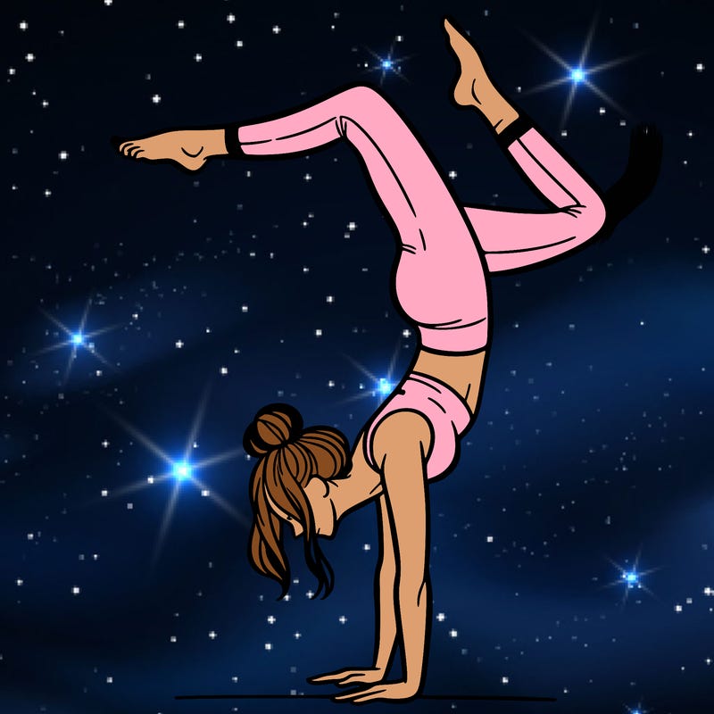 a woman doing a handstand