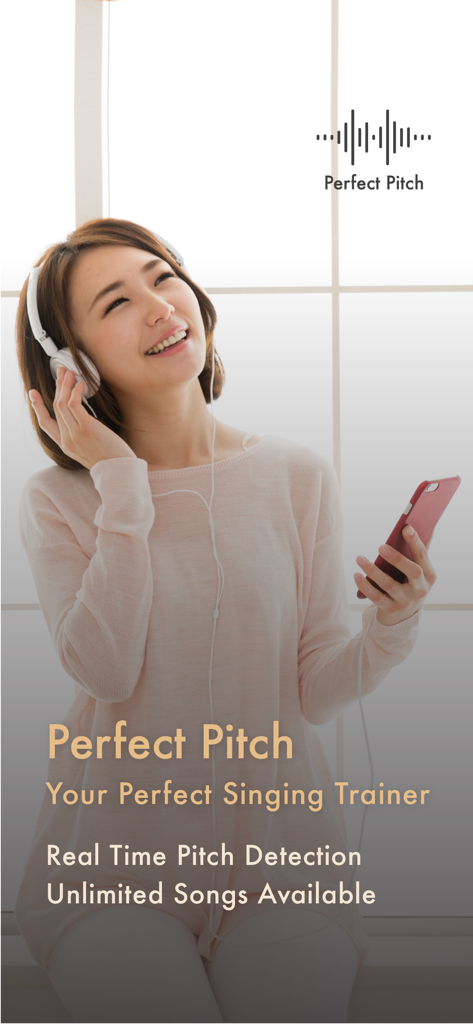 A young woman with headphones smiling and holding a smartphone while using the Perfect Pitch singing trainer app