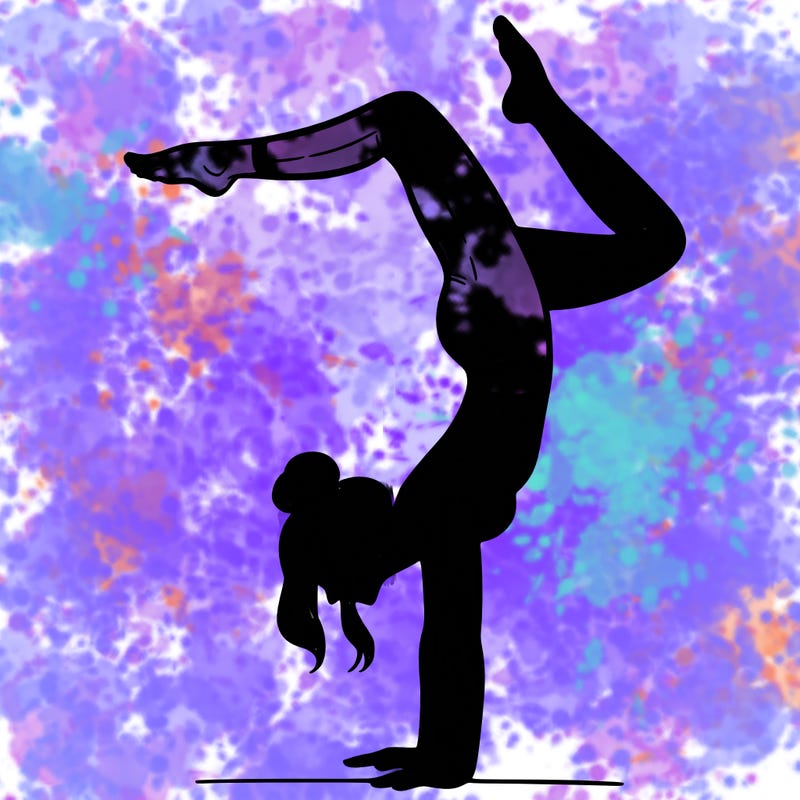 a woman doing a handstand
