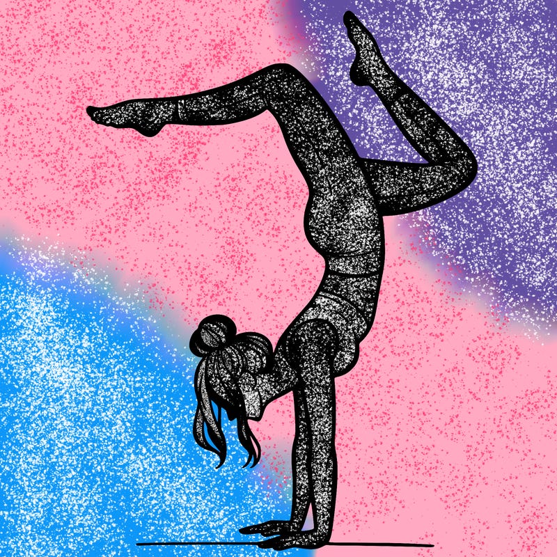 a woman doing a handstand