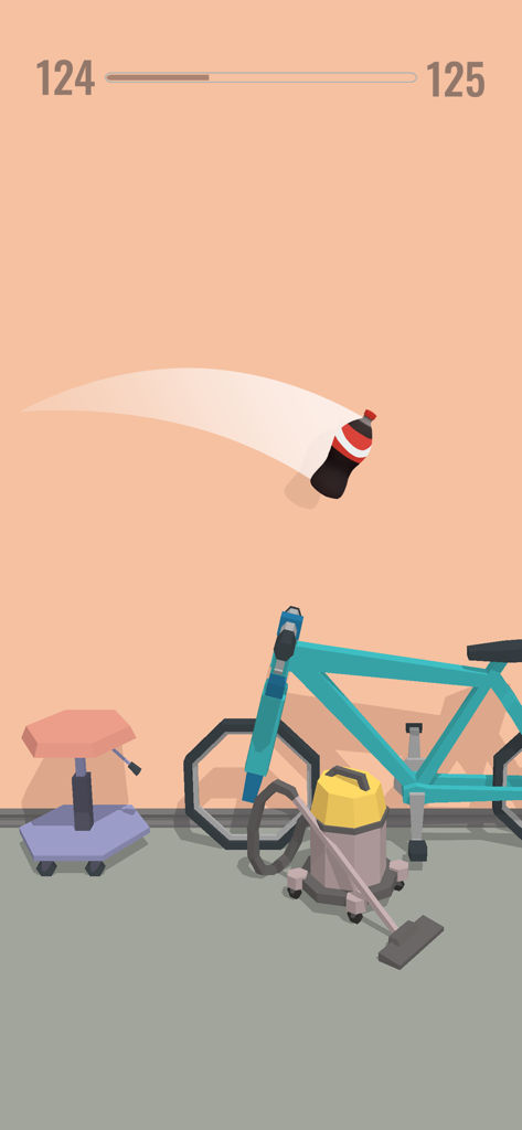 Bottle Jump 3D - Eine Limonadenflasche dreht sich über einem Fahrrad und einem Staubsauger im Bottle Jump 3D-Spiel