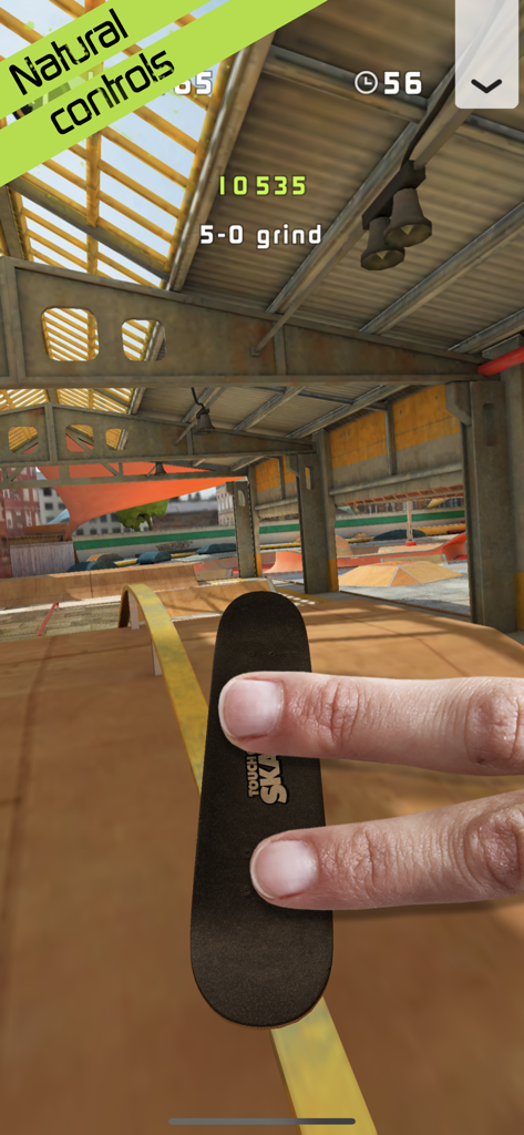 Touchgrind Skate 2 - Two fingers performing a 5-0 grind on a digital skateboard in Touchgrind Skate 2.