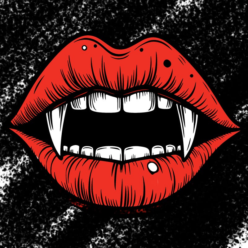 lips with vampire teeth