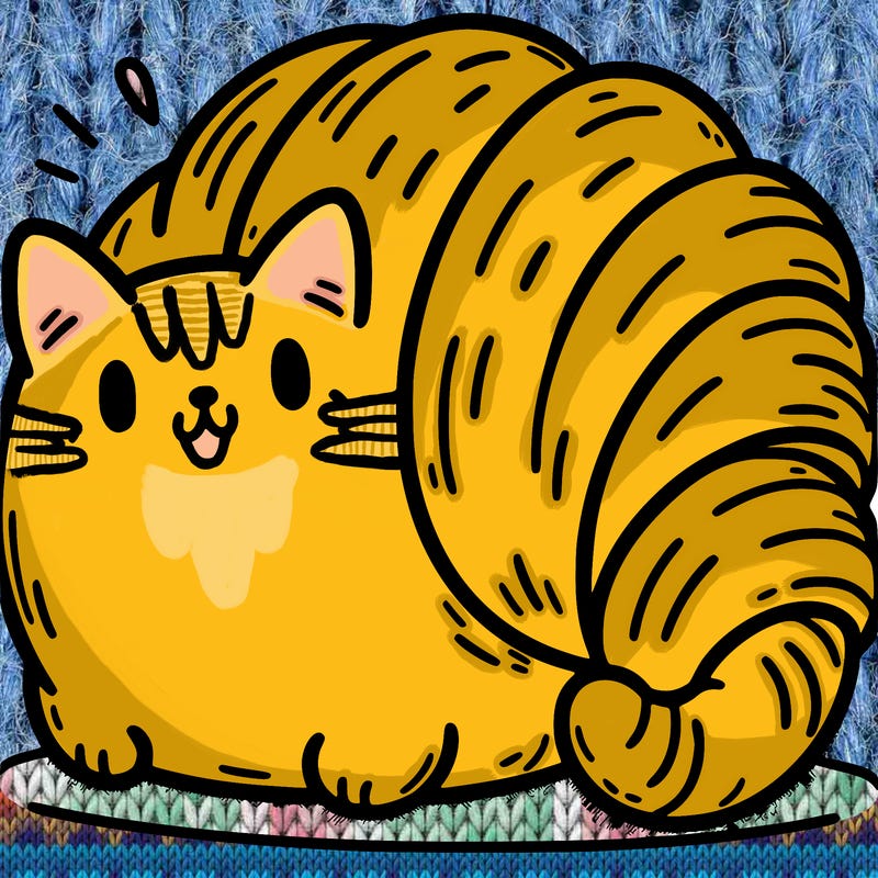 a chunky cat shaped like a croissant