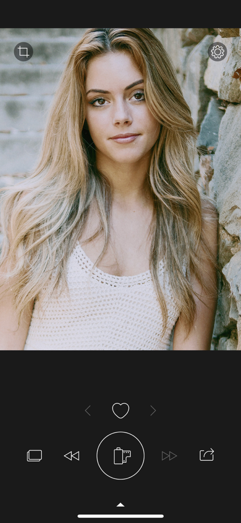 Portrait of a woman being edited in RNI Colibri app with film simulation colors