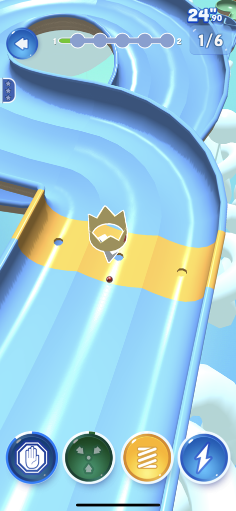 A marble racing on a winding blue 3D track in Marble Dream with power up icons at the bottom.