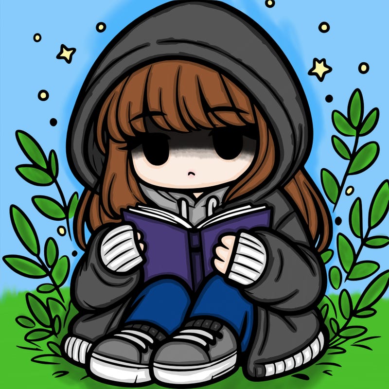 girl in oversized hoodie reading a book