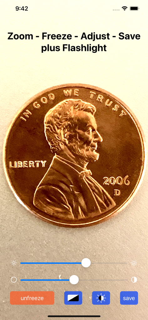 Magnifying Glass & Mirror - A magnified image of a penny within the Magnifying Glass app showing zoom and adjustment controls