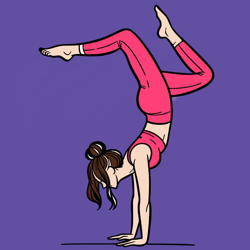 a woman doing a handstand