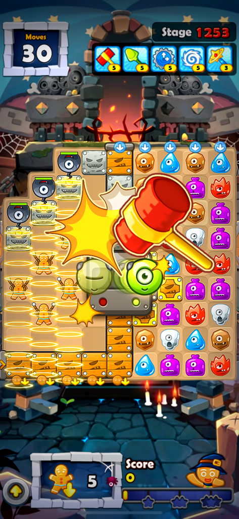 Monster Busters:Match 3 Puzzle - Gameplay screenshot of Monster Busters Match 3 Puzzle showing a giant red hammer booster hitting monster tiles to save gingerbread friends.