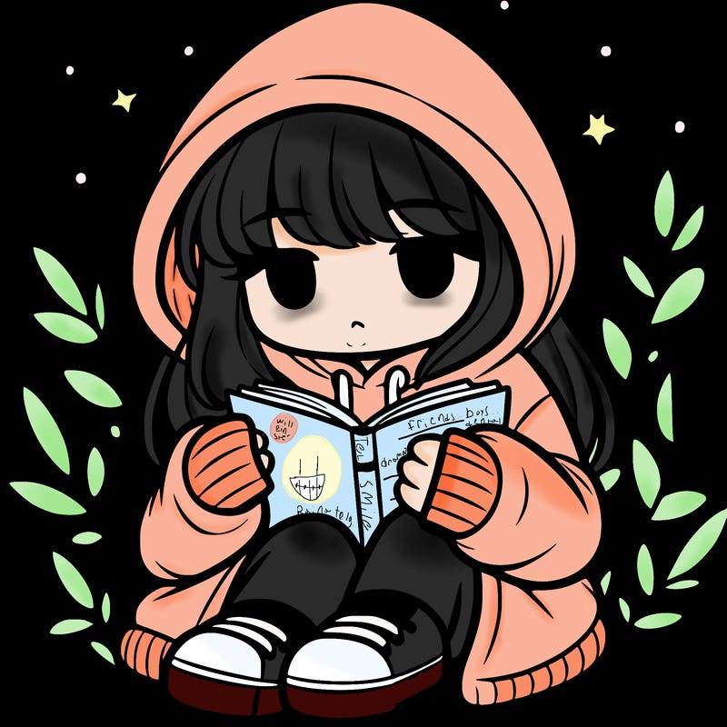 girl in oversized hoodie reading a book