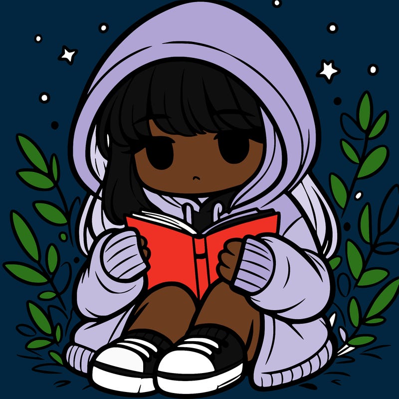 girl in oversized hoodie reading a book