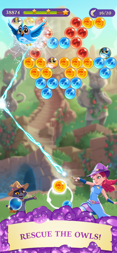 Bubble Witch 3 Saga - Stella the Witch aiming a magic line to pop colorful bubbles and rescue an owl